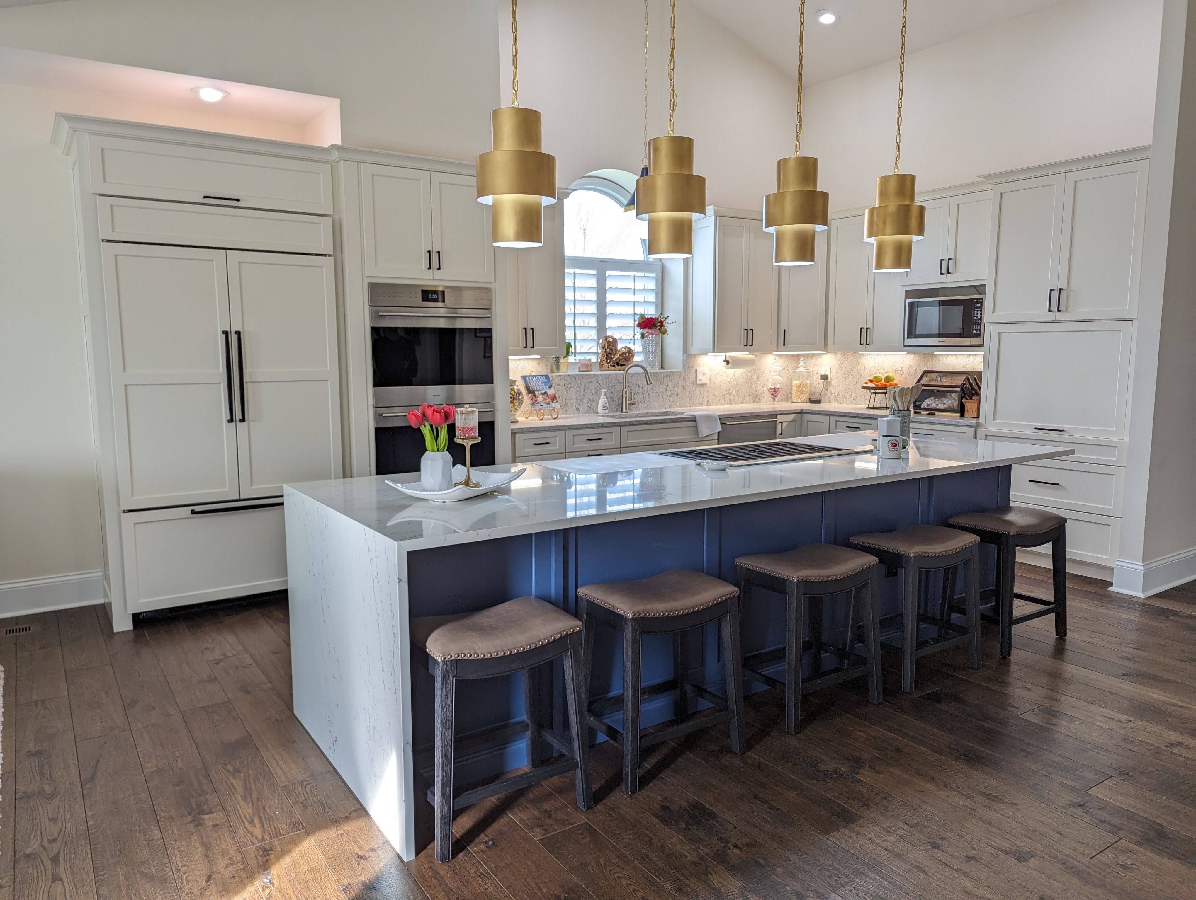 Cabinet Refacing Kitchen with white cabinets and blue island.